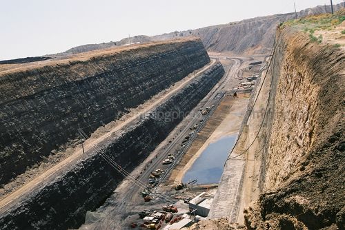 Aerial photo of power supply and access road for underground portal at open cut coal mine. - Mining Photo Stock Library