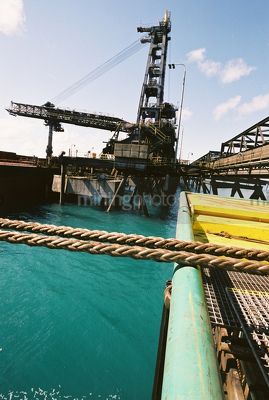 Ropes running over edge portside at Coal terminal - Mining Photo Stock Library