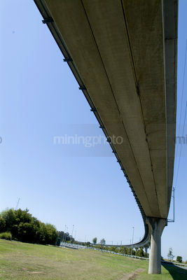 Light rail train flyover bridge curving away into distance - Mining Photo Stock Library