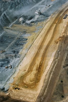 Aerial vertical shot of dragline and haul trucks in open cut coal mine. - Mining Photo Stock Library