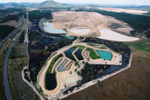 Water tailings dam in the shape of a platypus.  aerial photo. - Mining Photo Stock Library