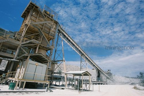 Processing plant in gold mine with blue sky behind - Mining Photo Stock Library