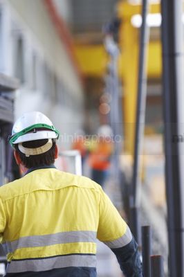 Mine construction worker in full PPE including fall arrest harness ready for the task. - Mining Photo Stock Library