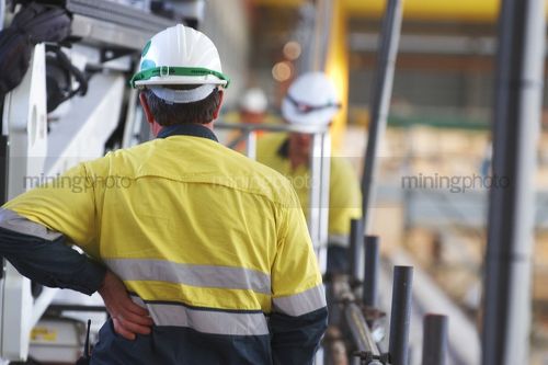 Mine construction worker in full PPE including fall arrest harness ready for the task. - Mining Photo Stock Library