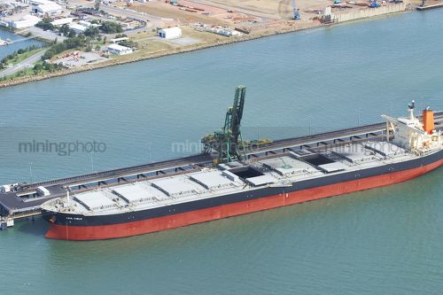 Aerial photo of a ship loader loading coal into a shop at coal wharf.   - Mining Photo Stock Library