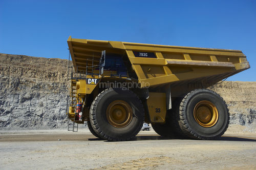 Haul truck moving on mine access road in open cut coal mine. - Mining Photo Stock Library