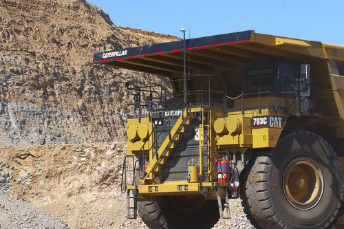 Close up photo of yellow 793  haul truck in open cut coal mine. - Mining Photo Stock Library