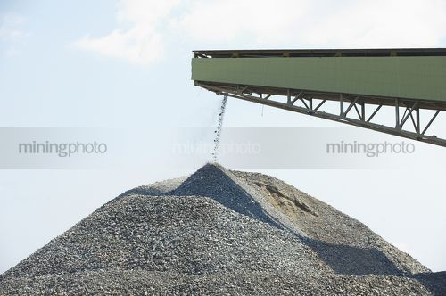Conveyor loading product onto a stockpile - Mining Photo Stock Library