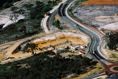 Road highway detouring around tunnel bridge development - Mining Photo Stock Library
