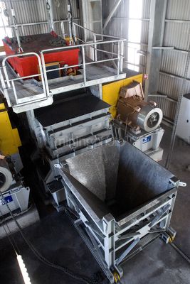 Coal hopper at the end of a conveyor at coal terminal. - Mining Photo Stock Library