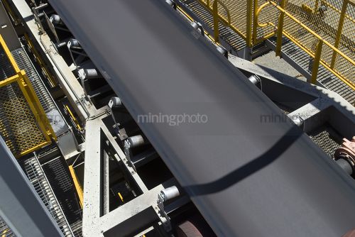 Aerial close up photo of a conveyor belt at a mine site.  - Mining Photo Stock Library