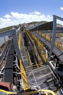 Wide photo of multi level coal conveyors arriving at coal terminal.  coal is delivered to stockpiles. - Mining Photo Stock Library