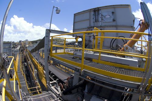 Wide photo of multi level coal conveyors arriving at coal terminal.  coal is delivered to stockpiles. - Mining Photo Stock Library