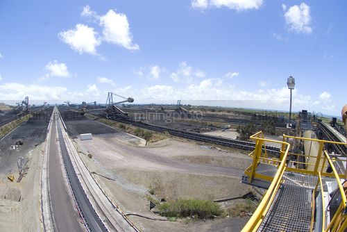 Coal terminal with reclaimers in the background. - Mining Photo Stock Library