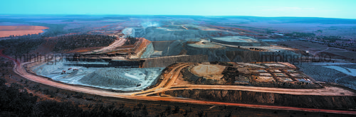 Aerial panorama photo of an open cut coal mine. photo captures every aspect of a mine - dragline, truck and digger rotation, stockpiling, dozer push. - Mining Photo Stock Library