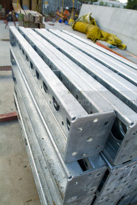 Steel supports stacked on building site. - Mining Photo Stock Library
