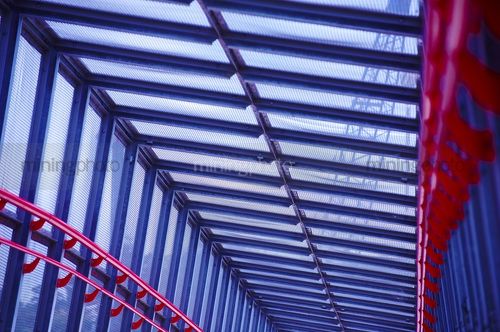Coloured covered walkway.  fully enclosed. - Mining Photo Stock Library