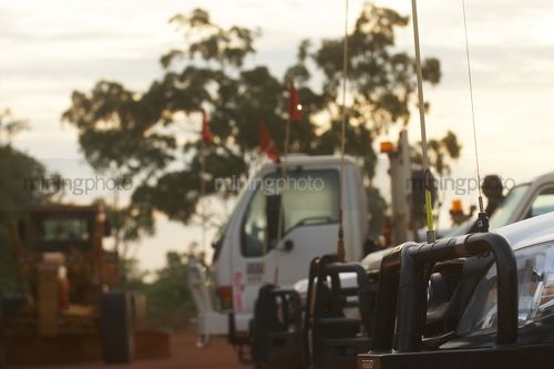 Photo looking along front of light vehicles at mining site.  generic image. - Mining Photo Stock Library