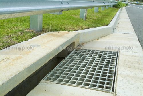 New stormwater drain and gutter in property subdivision - Mining Photo Stock Library