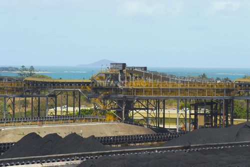 Wide photo of coal stockpiles at shipping coal terminal.  overhead conveyors clearly seen. - Mining Photo Stock Library