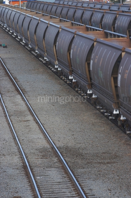 Close up photo of coal heavy rail carriages - Mining Photo Stock Library