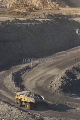Vertical aerial photo of loaded haul truck on open cut mine site. - Mining Photo Stock Library