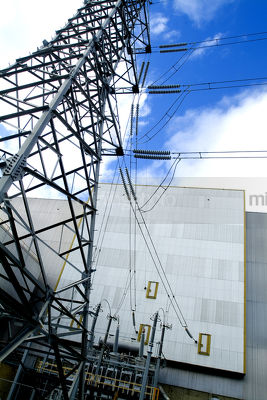 Transformer tower with electricity cables at power station - Mining Photo Stock Library