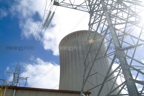 Cooling tower and transformer tower at power station - Mining Photo Stock Library