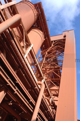 Conveyors and storage towers inside a refinery - Mining Photo Stock Library