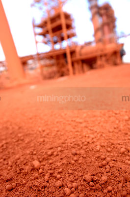 Bauxite closeup on the ground at a refinery - Mining Photo Stock Library