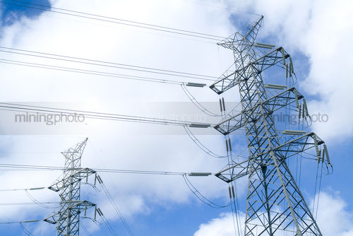 Transformer towers with electricity cables - Mining Photo Stock Library