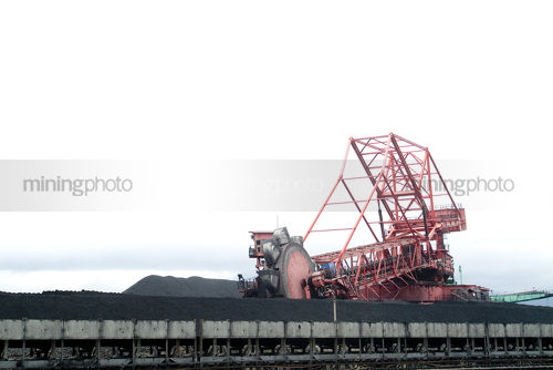 Coal reclaimer working around stockpiled coal  - Mining Photo Stock Library