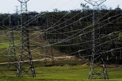 Electricity transformer towers in the countryside - Mining Photo Stock Library