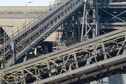 Conveyors closeup at mine site wash processing plant - Mining Photo Stock Library