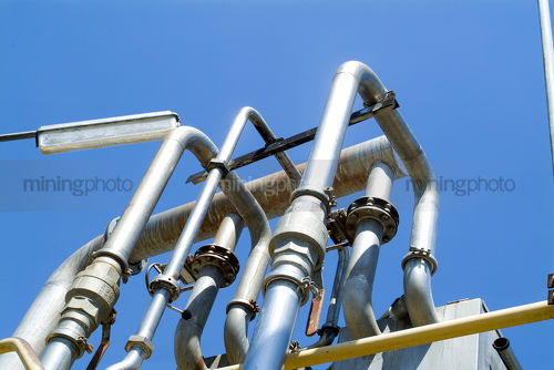 Pipes on mine site - Mining Photo Stock Library