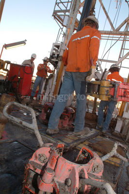 Workers on drill rig - Mining Photo Stock Library