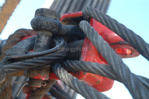Chain and cable shackles on drill rig mine site - Mining Photo Stock Library
