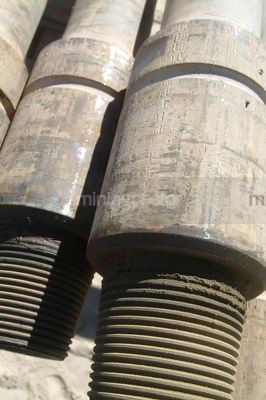 Closeup of drill rig pipe casing - Mining Photo Stock Library