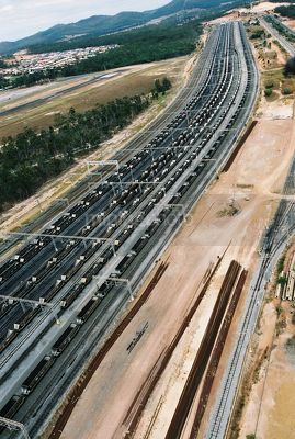 Many tracks of heavy rail in outback Queensland, some with coal trains on them.  aerial shot - Mining Photo Stock Library