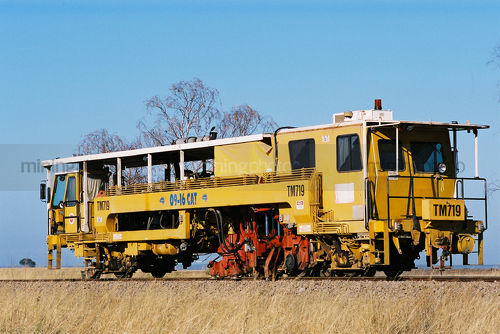 Heavy rail track repair train in Western Australia in rural countryside - Mining Photo Stock Library