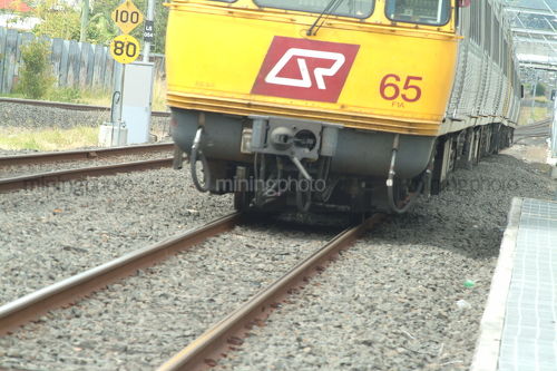 Light rail passenger train coming towards camera at a station - Mining Photo Stock Library