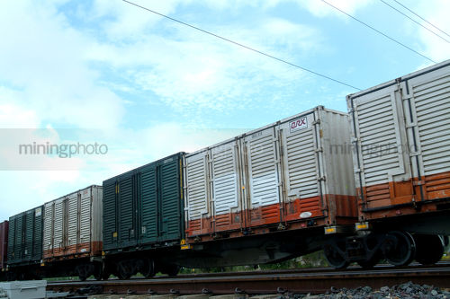Closeup of freight trains goods carriages - Mining Photo Stock Library