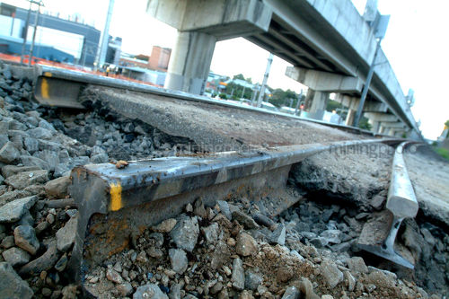 Rail track cut for upgrade work with rail overpass above. - Mining Photo Stock Library