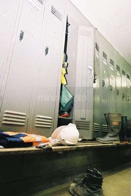 Mine workers locker room with PPE shirt and boots - Mining Photo Stock Library