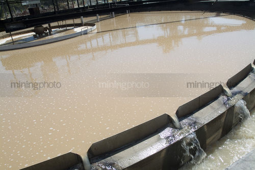 Closeup of separation tanks at water treatment works - Mining Photo Stock Library