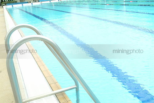 Swimming pool swim ladder - Mining Photo Stock Library