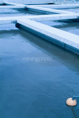 Rectangular water separation tanks at treatment works. - Mining Photo Stock Library