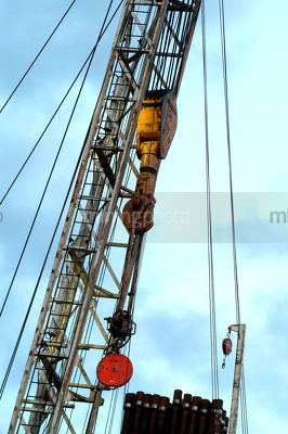 Oil and gas rig derrick with hook and cables - Mining Photo Stock Library
