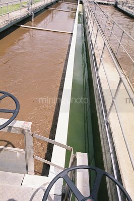 Looking along water separation sewage treatment plant - Mining Photo Stock Library