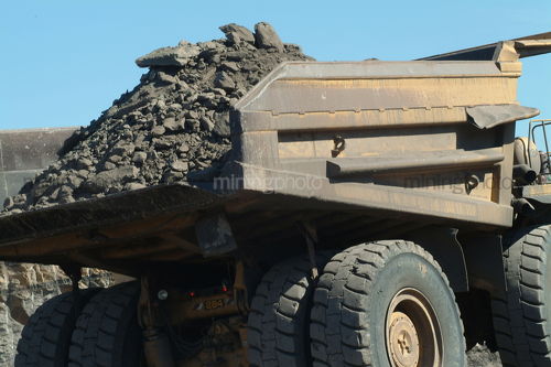 Large haul truck carting overburden on open cut mine site. - Mining Photo Stock Library